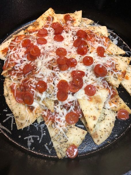 The Best Pizza Nacho Recipe That Tastes Like The Real Deal Pizza Nachos, Dried Basil, Tortillas, Nachos, Melted Butter, Oregano, Garlic Powder, Triangles, Parmesan