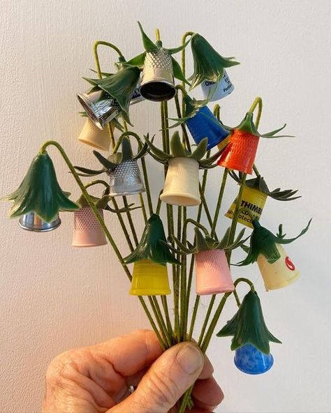 Magpie Ethel on Instagram: "Every spring some interesting flowers pop up in my yard. Thimble flowers! Freshly picked from my studio and such a cheerful bunch (all crafted with vintage thimbles). I’ve potted some and they’ll be Etsy bound with some other spring goodies (no date yet). The backdrop is a copy of an old flower show award tag dated 1959. Swipe for the cheer. #magpieethelspringcraft2022 #vintagethimble #thingsimake" Thimble Crafts, Pots Of Flowers, Diy Button Crafts, Thimble Art, Magpie Ethel, Sewing Decor, Thimble Collection, Buttons Crafts, Collectible Thimble