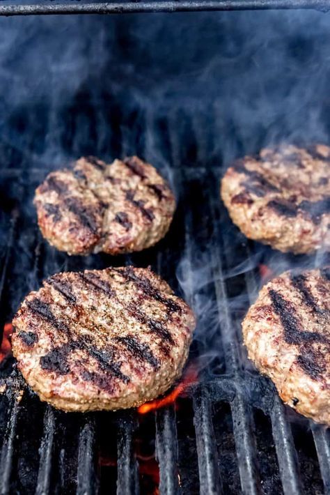 This Red, White, and Blueberry Bacon Burger with Basil Aioli is a mouthful in every sense!  A perfectly seasoned and grilled hamburger get topped with rich havarti cheese, blueberry balsamic compote, red onions, arugula, and an easy basil aioli, all on a brioche bun.  Perfect for Memorial Day, the 4th of July, or any other day of the year! #ad #SummerGrilling #TheSpiceHouse #burger #cheeseburger #cheese #blueberries #grilling #4thofJuly #havarti #aioli #basil #recipe #bacon