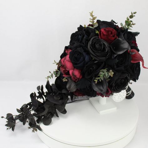 Custom Realistic Artificial Black & Burgundy Cascading wedding bouquet This stunning bouquet has been custom made with quality silk, real touch & foam flowers. The bouquet handle has been wrapped with satin/diamante ribbon and come with colour coordinated satin bows.  This bouquet is approximately 20 x 12 inches (50x 30cm) The matching buttonhole has also been made with silk & real touch flowers & custom made gothic style bone hand brooch & all buttonholes come with integral pin attached. These bouquets are also available in another listing in our shop Extra Large bouquet - 11 inches Large bridal bouquet - 9 inches Medium bridal bouquet 7 inches Small bouquet - 5-6 inches Flower girl wand 4-5 inches Corsages Head bands/Coronets Dark Romantic Wedding, Gothic Wedding Theme, Dark Wedding Theme, Bone Hand, Black Bouquet, Hand Brooch, Flower Girl Wand, Cascading Wedding Bouquets, Red Bouquet Wedding