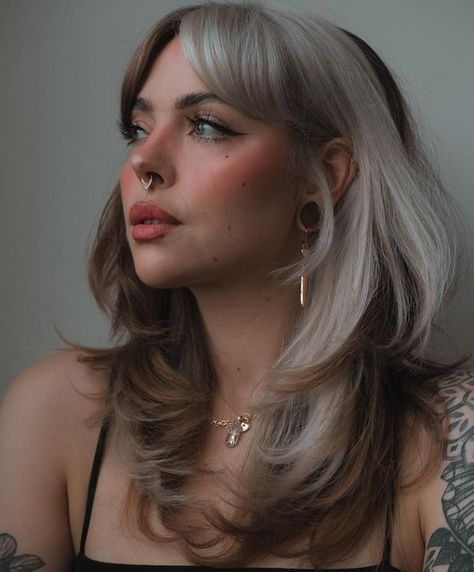 Shag Hair On Round Face, Blonde Hair Dark Peekaboo, Bangs And Layered Hair Shoulder Length, Block Placement Hair, Alt Women Haircut, Bold Hair Colors For Pale Skin, Women’s Edgy Haircuts, Stylish Long Haircut, Patchwork Hair Color