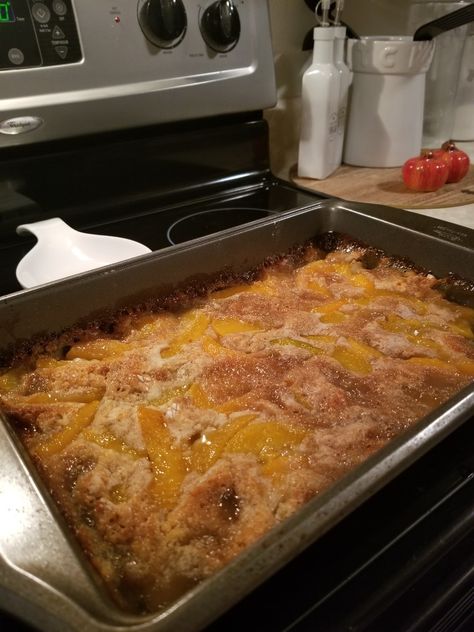 1 stick of salted butter, 1 cup of Krusteaz pancake mix, 1 large can of peaches, 1 cup of sugar, 1/2 cup of brown sugar, 1 1/2 tablespoons of cinnamon. Melt butter and pour into 9×13 baking dish. Mix batter and pour over butter evenly. Pour can of peaches with juice over batter. Sprinkle with pinch or 2 of brown sugar and cinnamon. Bake for 40 minutes. Perfect! Oven Peach Cobbler, Canned Peach Cobbler, Canned Peach Cobbler Recipe, Old Fashioned Peach Cobbler, Peach Cobbler Ingredients, Cobbler Crust, Cobbler Recipes Easy, Spiced Peaches, Cobbler Easy