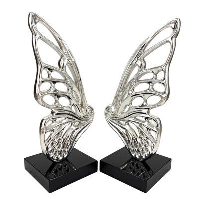 Introducing our Chrome Butterfly Resin Sculpture - a captivating blend of modern elegance and natural beauty. This stunning sculpture features two chrome wings with a special spiral center detail and intricate wing designs creating together a stunning Butterfly form sculpture. It rests on a sleek black base, creating a striking contrast. Perfect for any space, it's a unique gift for art and nature lovers. Add a touch of grace and sophistication to your decor with this exquisite butterfly sculptu Chrome Butterfly, Form Sculpture, Butterfly Sculpture, Butterfly Resin, Art And Nature, Grey Home Decor, Resin Sculpture, Wings Design, Functional Decor