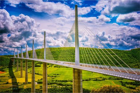 The Millau Viaduct is a multispan cable-stayed bridge, completed in 2004 across the gorge valley of the Tarn near (west of) Millau in the Aveyron department, the Occitanie Region, Southern of France. 

The bridge is supported by 7 slender pillars and therefore resembles a sailing boat. Millau Viaduct, Cable Stayed Bridge, The Gorge, Sailing Boat, The Bridge, Sailing, Bridge, Cable, France