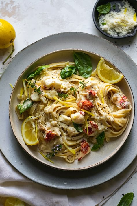 Creamy Lemon Pasta with Lobster is the ultimate date-night-in meal. It starts by poaching lobster tails in white wine & thyme, and ends with a simple, creamy lemon infused sauce. For a creamy pasta dish, it's rich, as to be expected, but still light enough in flavor to be perfect for summer! Especially with a crisp glass of white wine or rosé! #lobster #pasta #lemon #datenight #dinner Pasta With Lobster, Pasta With Lemon Sauce, Pasta Lemon, Creamy Lemon Pasta, Seafood Lobster, Cabo Trip, Fettuccine Recipes, Lobster Pasta, Meal Calendar