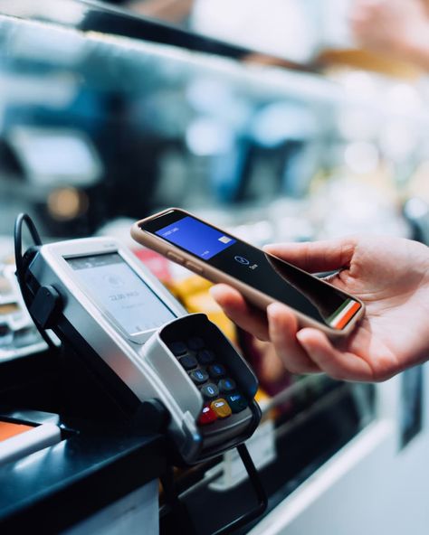 Close up of a woman's hand paying with her smartphone in a cafe, scan and pay a bill on a card machine making a quick and easy contactless payment. NFC technology, tap and go concept Budget Mom, Opening A Bank Account, Mobile Wallet, Mobile Payments, Credit Card Processing, Grocery Budgeting, Best Credit Cards, Save Money On Groceries, Good Credit