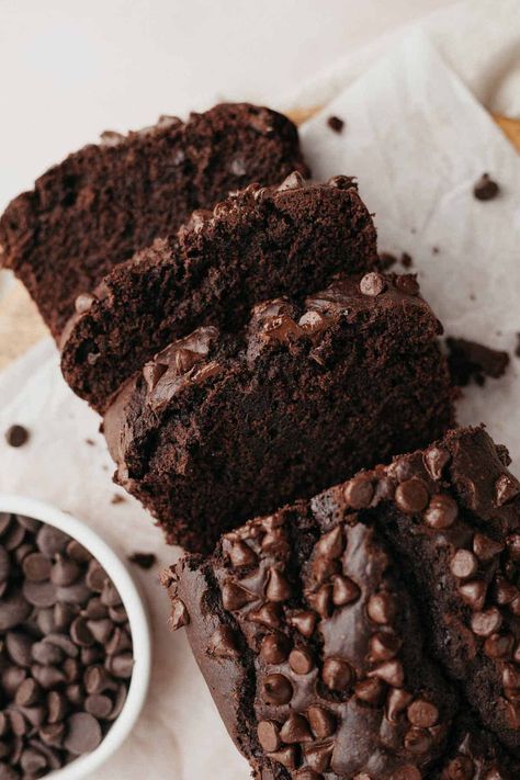 An overhead shot of a chocolate loaf cake topped with chocolate chips, three slices have been cut. Cake Mix Bread Recipes, Cake Mix Bread, Espresso Banana Bread, Chocolate Bread Recipe, Chocolate Loaf Cake, Chocolate Zucchini Bread, Sour Cream Pound Cake, Cake Chocolat, Chocolate Bread