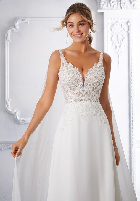 This chiffon and net A-line wedding dress features a v-neckline and straps. Mixed Wedding, Garden Style Wedding, Wedding Dress Silhouette, Grey Prom Dress, Spring Wedding Dress, Wedding 2025, Womens Prom Dresses, Embroidered Bodice, Bridesmaid Dress Sizes