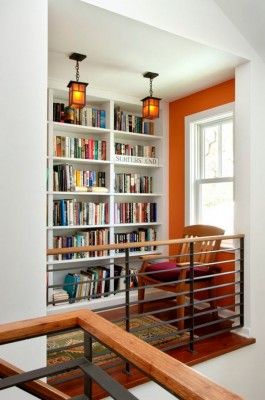 Home Library Design Ideas-42-1 Kindesign Home Library Design Ideas, Library Bar, Top Of Stairs, Beautiful Library, Home Library Design, Bookshelf Design, Stair Case, Orange Walls, Home Libraries