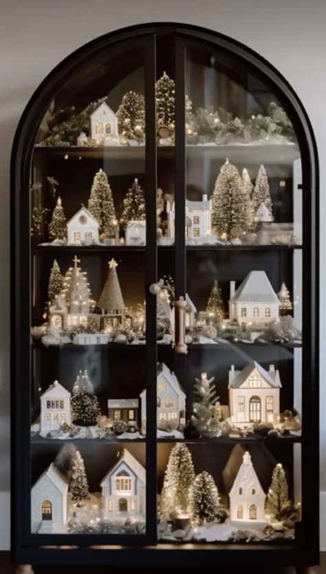 Christmas Decor Contemporary, Christmas Village Home Decor, Christmas Decor For Modern House, European Style Christmas Decor, Black Neutral Christmas Decor, Xmas Village Ideas, Christmas Aesthetic Modern, Mini Sleigh Decorating Ideas, Curio Cabinet Christmas Decor