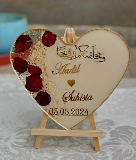 Celebrate your special day with this special engagement platter🫶🏼💍🫶🏼 Material used- epoxy resin 2:1 Golden granules Rose petals White & sand opaque pigment Metal handle Gold deco pen DM to customise♥️ #resinartist #resina #resinringplatter #resinartwork #couple #gift #resinahmedabad #resindaily #etsy #muslimwedding #islamicart Engagement Platter, Resin Frame, Resin Artwork, Resin Ring, Muslim Wedding, Couple Gift, White Sand, Rose Petals, Resin Crafts