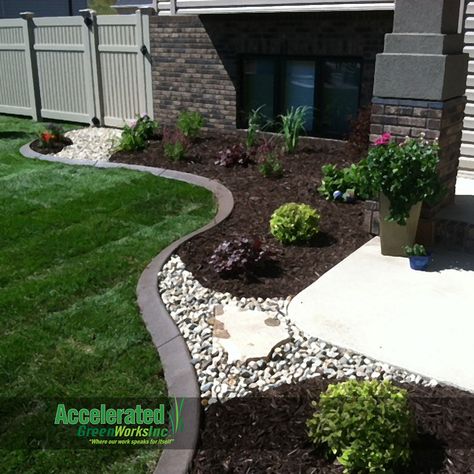 River rock and flagstone step stone allow access through the landscaping bed and break up the primary use of mink mulch.  The dark mulch really makes the green and purple shrubs/perennials pop in the landscaping bed. Flagstone Steps, Front Stairs, Cheap Landscaping Ideas, Mulch Landscaping, Creative Landscape, Front Entryway, Garden Shrubs, Garden Backyard, Home Landscaping