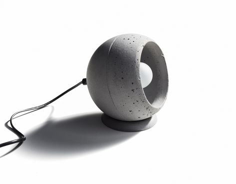 SUPERFLY-T is made of cast concrete. The concrete sphere could be rotated and placed in any position. Design by Urbi et Orbi studio in 2016. Pottery Lighting, Concrete Table Lamp, Concrete Light, Desktop Clock, Cement Diy, Concrete Lamp, Concrete Sink, Concrete Table, Concrete Crafts