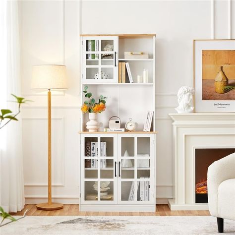 Maximize your kitchen storage while adding a touch of elegance with the 72'' Freestanding Kitchen Pantry Storage Cabinet with Hutch. This versatile, high-capacity cabinet offers both style and functionality, providing ample storage for your kitchen appliances, dishes, cookware, and more. The combination of engineered wood and tempered glass ensures long-lasting durability, while its clean white finish blends seamlessly with various home décor styles. Key Features: Durable & Sturdy Construction: Crafted from CARB P2-compliant engineered wood and tempered glass, this pantry storage cabinet can hold up to 176 lbs, making it strong enough to support your heaviest kitchen essentials. Optimized Storage Space: The upper section features a glass door cabinet and two open shelves, ideal for storing Freestanding Kitchen Pantry, Kitchen Storage Pantry, Free Standing Kitchen Cabinets, Glass Door Cabinet, Kitchen Pantry Storage Cabinet, Storage Pantry, Pantry Storage Cabinet, Freestanding Kitchen, Kitchen Pantry Storage