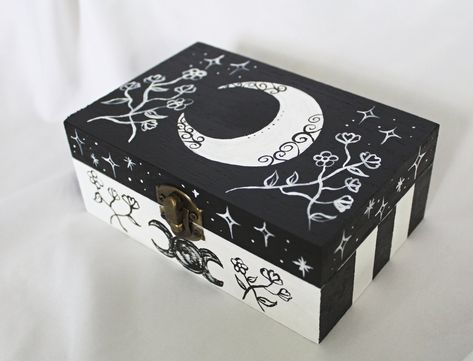 This is a hand painted tarot card box.  It can be used for anything you want, but it fits most tarot cards.  This box features a crescent moon and wildflowers.  Approximately 6 inches long, 4 inches wide, and 2.5 inches high. I only keep a few things in my etsy shop now.  My full collection of art and antiques has been moved to my website. To see all of my collection you can find it here:  https://www.wildflowermoonmagic.com/ Wooden Box Crafts, Hand Painted Wooden Box, Jewelry Box Makeover, Painted Box, Painted Wooden Boxes, Small Wooden Boxes, Jewelry Box Diy, Painted Jars, Painted Jewelry