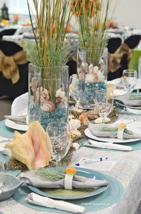 Aqua and natural coastal themed tablescape Beach Theme Rehearsal Dinner Decorations, Ocean Themed Tablescape, Sea Themed Wedding Decorations, Under The Sea Table Setting, Ocean Themed Table Decor, Beach Theme Tablescape, Sea Themed Dinner Party, Beach Themed Table Decor, Ocean Table Decorations