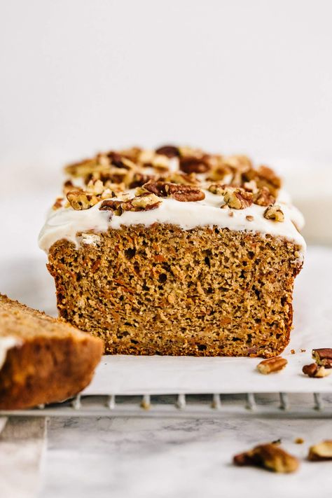 A healthier carrot cake banana bread with dairy-free cream cheese frosting. This recipe is made oat flour, almond flour, maple syrup and topped with a lightened-up cream cheese Greek yogurt frosting. Enjoy for breakfast or to bring to a holiday brunch! Healthier Carrot Cake, Carrot Cake Banana Bread, Dairy Free Cream Cheese Frosting, Greek Yogurt Frosting, Cake Banana Bread, Carrot Cake Bread, Carrot Banana Cake, Healthy Carrot Cake, Bread Healthy