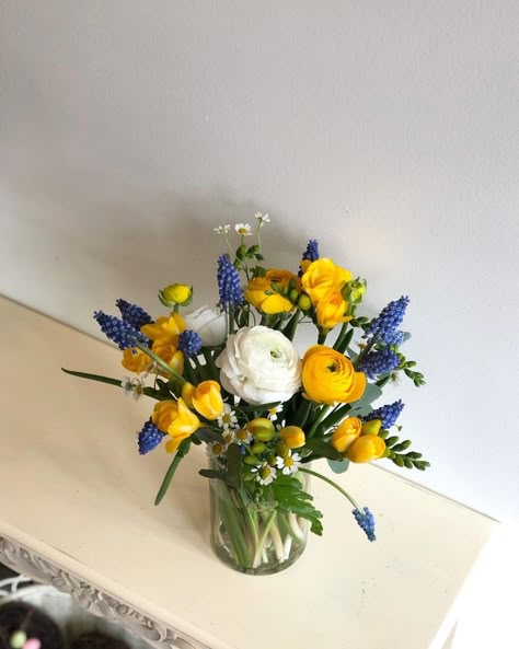 Blue Yellow White Flower Arrangement, Yellow Blue Floral Arrangement, Blue Yellow White Centerpieces, White Yellow Flower Arrangement, Blue Orange Yellow Floral Arrangement, Blue And Yellow Centerpieces Graduation, Yellow Pink Blue Flower Arrangement, Yellow Flowers Centerpiece, Yellow Blue Flower Arrangement