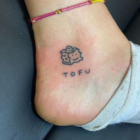 Handpoke. Brighton. London. on Instagram: “Little tofu tattoo for Ruth. Thank you so much. ⚜️🦆🦥🏠🎉🍩🦐🌵🦙🛴🧚🏽‍♂️🐣🚭😊🥊🔞🏄🏽#tofu #tattoo #tattoos #handpoke #handpoked #machinefree #modernart…” Tofu Tattoo, Brighton London, Fashion Fairytale, Infinity Tattoo, Thank You So Much, Paw Print Tattoo, Jesus Fish Tattoo, Brighton, Tatting