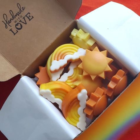 Add the essence of summer to your space with our Sunshine & Rainbows Soy Wax Melts. Crafted with sun and rainbow designs, these wax melts will bring a touch of beauty and brightness to your home. Made with soy wax, they offer a clean and long-lasting burn for you to enjoy. Our wax melts are adored for their ability to create a soothing ambiance, enhance aesthetics, emit a pleasant aroma, promote relaxation, evoke memories, and serves as a thoughtful gift or decorative item for your home or offic Unique Wax Melt Ideas, Wax Melts That Look Like Food, Cute Wax Melts, Apricot Orchard, Wax Melt Ideas, Sun And Rainbow, Diy Wax Melts, Candle Fragrance Oil, Candle Molds Diy