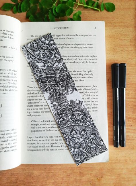 Picture of a mandala bookmark placed on top of a book. The mandala bookmark includes intricate designs, motifs, and floral patterns that look beautiful. Mandala Bookmark, Mandala Bookmark Ideas, Mandala Art For Bookmarks, Bookmark Dot Mandala, Bookmarks Handmade Mandala, Mandala Bookmark Hand Drawn, Creative Bookmarks, Mandala Art, Turn Ons