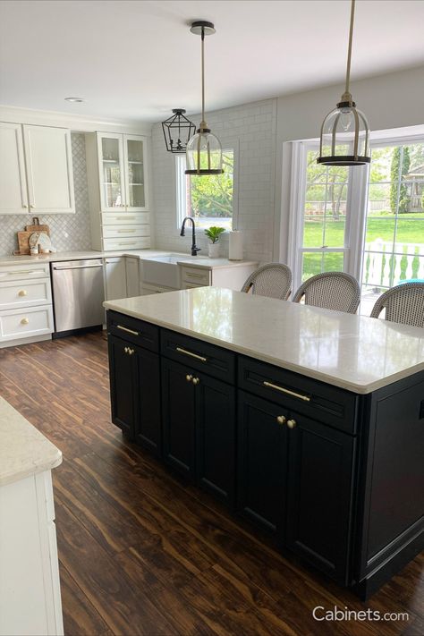 With its Ebony island and Alabaster perimeter cabinets, this beauteous kitchen offers some serious competition to the views outside. Kitchen Black Island, White Kitchen Black Island, Two Toned Kitchen Cabinets, Transitional Style Kitchen, Black Island, Order Kitchen, Two Tone Kitchen, Kitchen Black, Style Kitchen