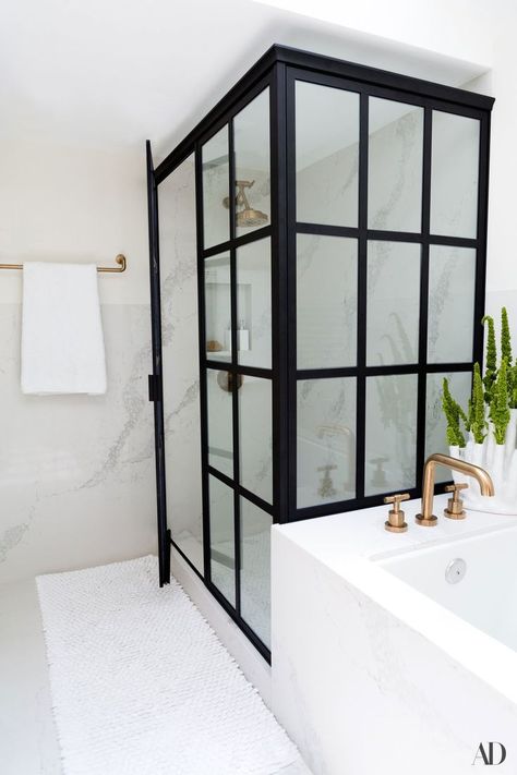 “I was always quite clear about what I wanted,” says fashion stylist and television host Louise Roe of her Los Angeles master bathroom renovation. “I wanted a beautiful, clean marble or quartz. We ended up doing quartz, which has a great vein going through it but nothing so dramatic that it detracts from the accessories in the room.” Hollywood Hills Homes, Budget Bathroom Remodel, Louise Roe, Cabinetry Design, Black Shower, Bath Room, Marble Bathroom, Los Angeles Homes, Shower Door