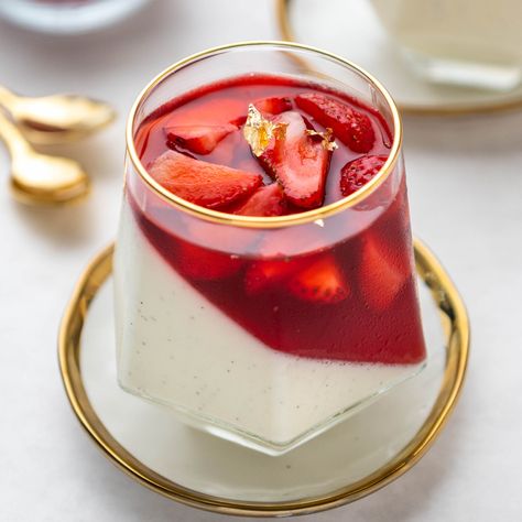 This panna cotta dessert served inside of a wine glass will impress your party guests! This vanilla bean panna cotta and strawberry gelée is easy to prepare ahead of time and makes for a stunning dessert presentation. This is a great dessert for valentines day, wedding dessert, bridal showers or any special event. The tilted gelee brings this dessert to a ultra sophisticated level and is absolutely delicious to eat. Gelee Recipe, Strawberry Gel, Vegetarian Substitutes, Sugar Geek, Cake Mug, Dessert Presentation, Waffle Cookies, Roasted Strawberries, Strawberry Jelly