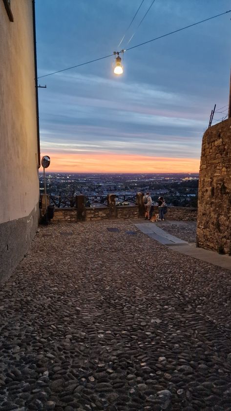 Amazing Sunset in Bergamo Alta, Northern Italy Italy Bergamo, Chav Outfits, Dream Backyard Garden, Italy Vibes, Bergamo Italy, Amazing Sunsets, Europe Travel Destinations, Dream Backyard, A Hill