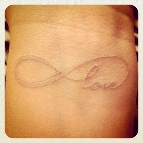 love the infinity sign tattoos Infinity Love Tattoo, Love Quote Tattoos, White Ink Tattoo, Omerta Tattoo, Love Tattoo, 1 Tattoo, Girly Tattoos, White Tattoo, Skin Art