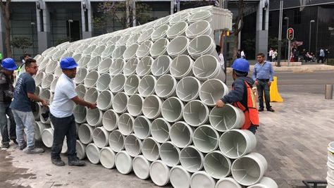 wave of buckets floods mextropolis architecture festival in mexico city Upcycle Plastic, A Frame House Plans, Dome House, A Frame House, Parking Design, Public Spaces, Outdoor Art, Buckets, Exhibition Design