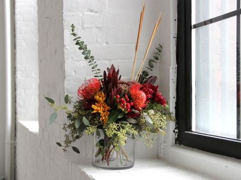 Whether you're a floral pro or a novice designer, freshen up your home this fall with unique, colorful floral designs you can recreate using budget-friendly blooms and upcycled vessels. Thanksgiving Flower Centerpieces, Thanksgiving Flower Arrangements, Simple Centerpieces Diy, Thanksgiving Floral Arrangements, Diy Floral Centerpieces, Thanksgiving Floral, Thanksgiving Flowers, Fall Flower Arrangements, Fall Floral Arrangements