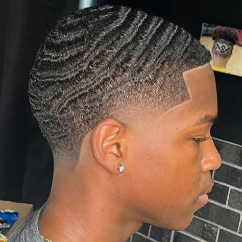 Rock a stylish look with afro hair styled into 360 waves. Embrace a suave and sophisticated hairstyle. 🌊 Mens Waves Haircut, Men Waves, 360 Waves Men Taper, 360 Waves Haircut, Black Men Waves Haircut, Waves Black Men, Waves 360, 360 Waves Men, Waves Hair