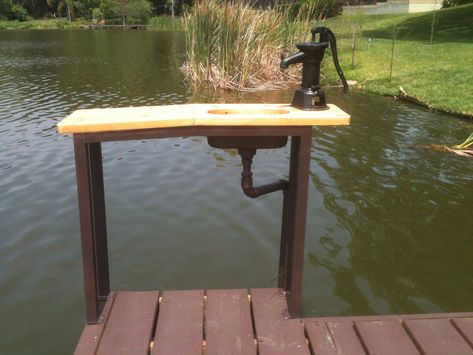 Custom fish cleaning table I made with stainless sink, hand pump, and cedar top. Pond Pier Ideas, Pond Docks, Floating Picnic Table, Pond Dock, River Dock, Dock Bar, Diy Dock, Dock Ideas, Fish Cleaning Station