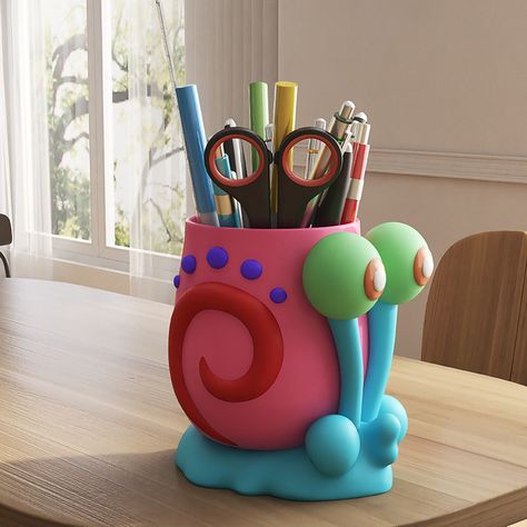 Meet your new favorite desk companion—the Whimsical Snail Pen Holder with Big Eyes. This colorful and quirky pen holder is designed to look like a delightful snail with oversized eyes, bringing a sense of fun and creativity to any workspace. It’s perfect for organizing your pens and pencils while adding a splash of color to your desk. Whether for a home office, children's room, or as a thoughtful gift, this charming snail pen holder is sure to delight and inspire. Paintbrush Holder Clay, Polymer Clay Pen Holder, Cool Ceramics Projects, Pencil Holder Ideas, Pottery For Kids, Whimsical Snail, Office Pen Holder, Unique Key Holder, Cute Pen Holder