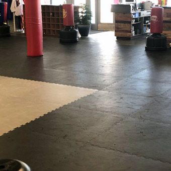 “They made it 16 years, and we didn’t even have to flip them over,” Troy said. “The only time we flipped them over was just to change the color of the sparring ring. … You can find (puzzle mats) anywhere, but to find them durable enough to last… nothing lasts 16 years anymore. It’s almost impossible to find anything that’s going to last 5 years, let alone 16.” Stockbridge Tae Kwon Do Academy Martial Arts Mats, Interlocking Foam Mats, Interlocking Floor Tiles, Martial Arts Instructor, Interlocking Foam Tiles, Foam Mat Flooring, Basement Gym, Tae Kwon Do, Foam Tiles