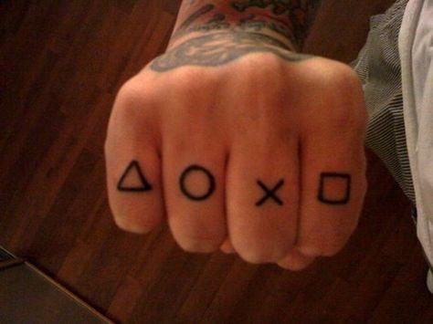 Video Game Tattoos for Men - Gamer Tattoo Ideas for Guys Playstation Tattoo, Video Game Tattoos, Button Tattoo, Tattooed Man, Tattoo Catalog, Gamer Tattoos, Tattoos Infinity, Video Game Tattoo, Knuckle Tattoos