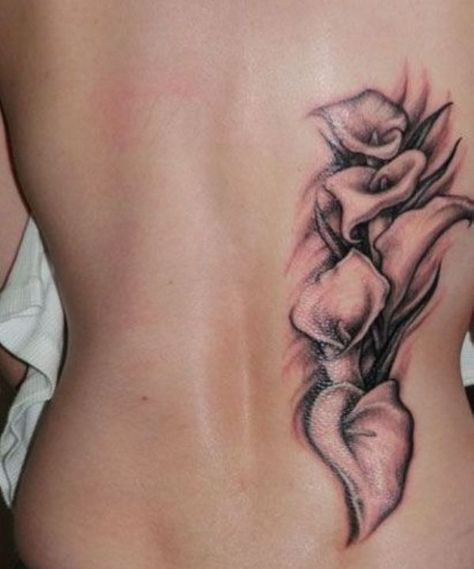 70+ Amazing Calla Lily Tattoo Designs with Meanings, and Ideas 50 Lily Tattoo Black And White, Calla Lily Tattoo, Lily Tattoos, Back Tattoos Spine, Lower Back Tattoo Designs, Lily Tattoo Design, Tattoo Black And White, Girl Back Tattoos, Lily Tattoo