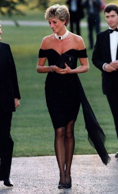 Princess Diana's Revenge Dress; she wore this dress designed by Christiana Stambolian to a party at the Serpentine Gallery on June 29, 1994, the day Prince Charles publicly admitted to committing adultery. The dress instantly became an icon and a seminal moment in the public life of the late princess. Princess Diana Revenge Dress, Revenge Dress, Princess Diana Fashion, Princes Diana, Diana Fashion, Elisabeth Ii, Bride Guide, Blue Ivy, Lady Diana Spencer