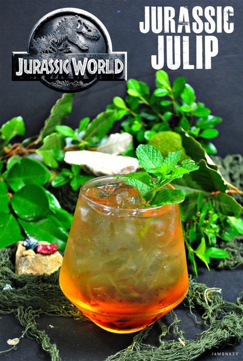 Jurassic Julep a Peach Mint Julep Cocktail that is perfect for Jurassic Park themed parties! #JurassicPark #JurassicWorld #Cocktails #Drinks #Peach #Julep Dinosaur Cocktails, Movie Meals, Mint Julep Cocktail, Jurassic Park Birthday Party, Themed Cocktails, Jurassic Park Party, Disney Drinks, Coffee Milkshake, Alcohol Dispenser