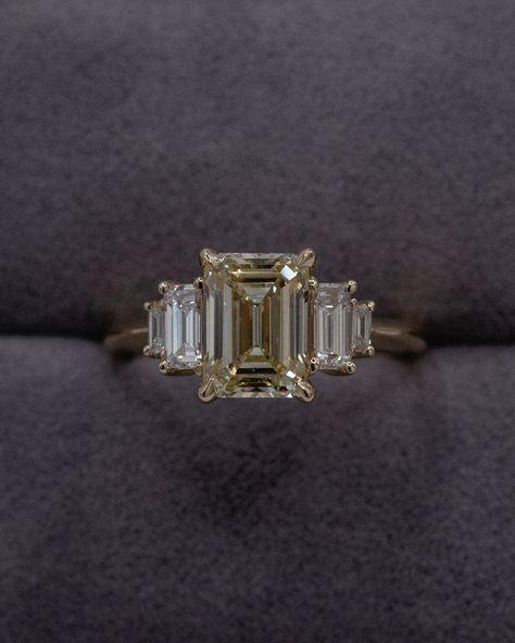 Laher Signature⌇Five stone of Warm White Emerald Cut w/ White Baguette Cuts.   Amazing 🤍  Laher Design | Green Sapphire & Unique Coloured Diamond Engagement Rings.   Sydney, Australia. Emerald Ring With Baguettes, Champagne Emerald Cut Engagement Ring, Yellow Diamond Emerald Cut, Unique Emerald Cut Engagement Rings, Emerald Green Engagement Ring, Champagne Engagement Ring, Emerald Cut Wedding Ring, Champagne Diamond Engagement Ring, Colored Diamond Engagement Rings