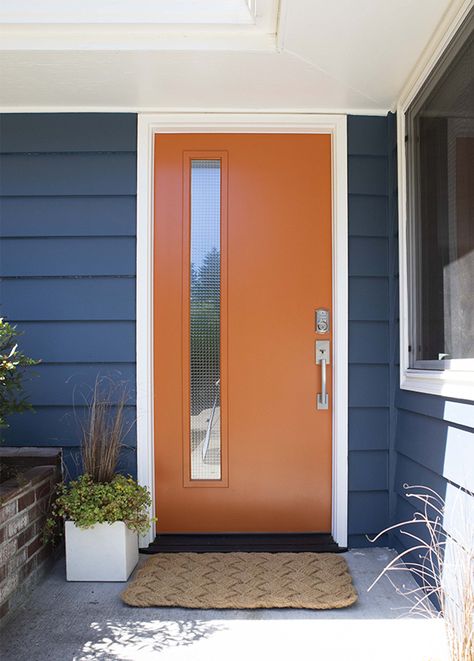 Mid Mod Front Doors, Navy Blue House Exterior Orange Door, Mid Century Front Door Ideas, Color Pop Front Door, Mcm Exterior Door, Rustic Orange Front Door, Mid Century Door Colors, Mid Century Exterior Door, Modern Painted Front Door