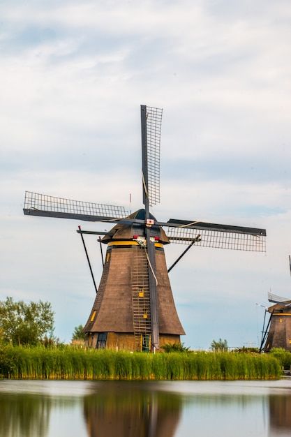 Kinderdijk windmills next to rotterdam a... | Premium Photo #Freepik #photo #water-mill #rural #field #farm-field Kinderdijk Windmills, Mill Painting, Dutch Mill, Windmills Photography, Windmill Photos, Water Wheels, Photo Water, Netherlands Flag, Rotterdam Netherlands