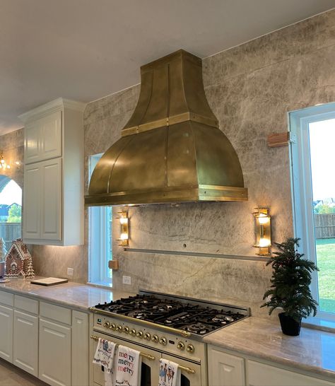 Our clients truly made this hood unique and special. We absolutely adore this stunning antique brass hood! The Royal design complements their kitchen beautifully and takes the kitchen’s focal point to a whole new level. It’s a perfect example of how a custom range hood can enhance your kitchen. There’s nothing quite like it! #rangehoods #customrangehood #customdesign #interiordesign #kitchensofinstagram #luxury Stone Vent Hood, Brass Hood, Kitchen S, Custom Range Hood, Vent Hood, Royal Design, Range Hoods, Range Hood, Antique Brass