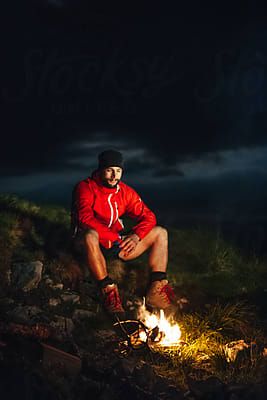 I quite like this pose/scene idea. Compliments the whole dark/light aesthetic of the clothing. Dark Light Aesthetic, Man With Beard, Mountains At Night, Mountain Pose, Light Aesthetic, Smiling Man, Man Sitting, Fire Art, Character Poses