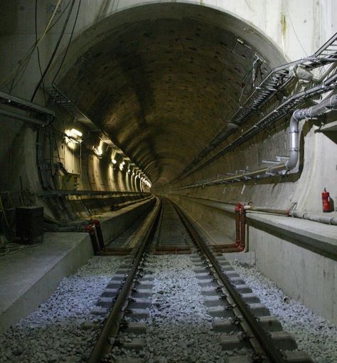 The Channel Tunnel is a 50.45-kilometre (31.35 mi) rail tunnel linking Folkestone, Kent, in the United Kingdom, with Coquelles, Pas-de-Calais, near Calais in northern France, beneath the English Channel at the Strait of Dover. At its lowest point, it is 75 m (250 ft) deep below the sea bed and 115 m (380 ft) below sea level. At 37.9 kilometres (23.5 mi), the tunnel has the longest undersea portion of any tunnel in the world. Channel Tunnel, Sea Bed, Northern France, English Channel, Construction Machines, Sea Level, The English, The Sea, United Kingdom