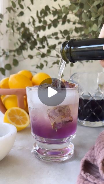 Sugar & Charm / Eden Passante on Instagram: "Butterfly Pea Flower Spritz 🦋 This coloring-changing spritz is made with a few ingredients and couldn’t be easier. It is visually stunning with its natural purple hue and has a light and refreshing taste that is perfect for springtime. 

The flowers are known for their vibrant blue color, which turns into a bright purple shade when mixed with acidic ingredients like lemon juice or tonic water. This is one of my favorite cocktails to serve when it’s starting to warm up outside and the flowers blooming

Make the simple syrup and store it in the fridge for a week to quickly whip up a cocktail when needed. 

You can make this a mocktail using zero-proof vodka and non-alcoholic sparkling wine, tea, or tonic.

Spritz is easy to make for a crowd becau Drink Display, Butterfly Pea Flower, Flowers Blooming, Butterfly Pea, Pea Flower, Tonic Water, Bright Purple, Few Ingredients, Purple Hues