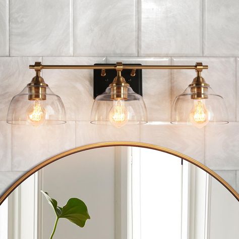 Vanity Light Over Arched Mirror, Organic Modern Bathroom Vanity Lights, Brass Bathroom Lighting Over Mirror, Coastal Bathroom Vanity Lighting, Black And Brass Vanity Light, Champagne Bronze Vanity Light, Vanity Light Fixtures Bathroom, Gold Light Fixture Bathroom, Black And Gold Bathroom Fixtures