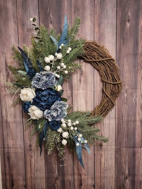 Handmade. Made to order. Tip to tip measurements: Height: 28" Width: 25" Depth: 6" - 8" Indoor or outdoor use This Elegant Blue and White Peony Rose Winter Christmas Wreath is the perfect statement piece for the front door, above your mantle, or the wall.   This wreath is handcrafted each time with care. No two are alike, but always created with the same amount of material and the same attention to detail, to create a one-of-a-kind masterpiece for you. It will take 1-3 days for it to be created and ready for shipping. Check out more wreaths on my full shop: https://www.etsy.com/shop/FlorasSecretGarden IMPORTANTDO NOT PLACE IN EXTREME HEAT The glue may melt. Please be aware that wreaths placed outdoors will weather or deteriorate over time from exposure to elements. The wreath should be hun Mantel Floral Arrangements, Front Door Blue, Blue Flower Wreath, Pink Christmas Wreath, Floral Door Wreaths, White Christmas Wreath, Christmas Wreath For Front Door, Winter Wreaths, Door Wreaths Diy