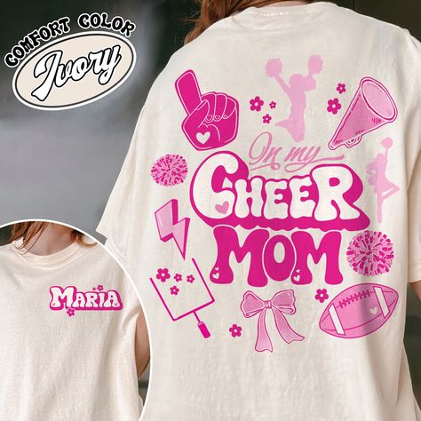 In My Cheer Mom Era T-Shirt - Custom Cheer Mom Vintage Shirt Football and Cheer Women's Shirt Discover Gooberch's Comfort Colors T-Shirts: Where Family Love Meets Cozy Style! Our Comfort Colors tees are perfect for the whole family. They're super soft, comfy, and come in cool vintage colors. Whether you want funny shirts, holiday designs, or matching family outfits, we've got you covered! Key... Football And Cheer Mom, Cheer Mom Shirt, Cheerleading Shirts, Cheer Mom Shirts, Mom Lifestyle, Tshirt Custom, Cheer Shirts, Comfort Colors Tshirt, Mom Era